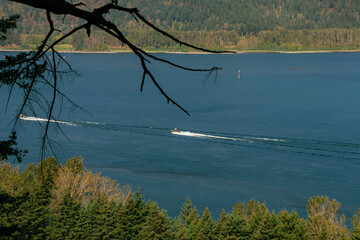 Two boats driving in the Columbia river viewed from along the Multnomah Falls Trail Switchback hike