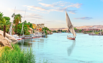 Traditional felucca in the Nile river, Aswan, Egypt, beautiful summer scenery