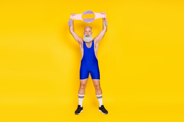 Fototapeta na wymiar Full body photo of excited funky person arms hold soft fluffy champion belt isolated on yellow color background