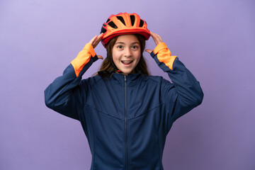 Little caucasian girl isolated on purple background with surprise expression