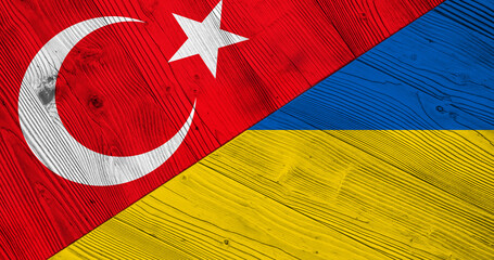 Background with Turkey and Ukraine flag on wooden split table. 3d illustration