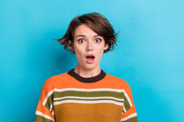 Portrait of astonished impressed woman with short hairdo wear orange sweater staring at discount...