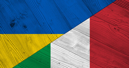Background with flag of Ukraine and Italy on wooden split table. 3d illustration