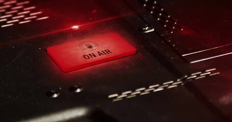 On Air symbol light flashing on metal panel macro view. Radio live studio and podcast microphone lamp sign on industrial dashboard loop. Loopable and seamless abstract icon technology concept.