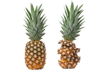 Two fresh juicy pineapples with different shapes. Sliced and whole. Isolated