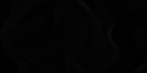 Black crumpled paper texture background. A crumpled sheet of dark gray paper abstract background.	
