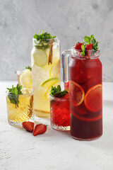 Freshly summer drinks - lemonades isolated on white concrete background