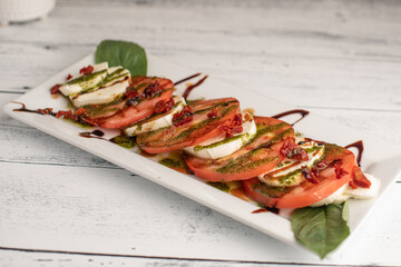 Caprese Salad on a white wooden table