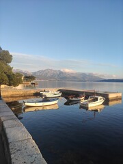 boats in the bay on the sea against the backdrop of mountains in Montenegro