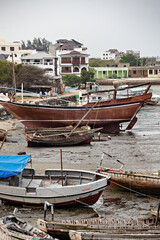 Fototapeta na wymiar Local fishermen and fishing boats in Lamu island, Kenya