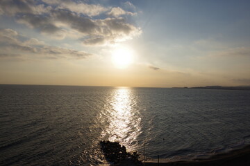 Sun in clouds over the mediterranean sea