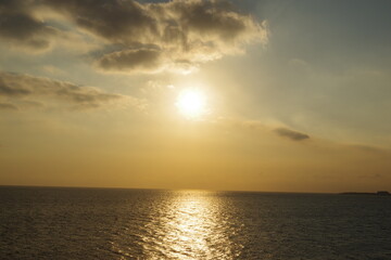 Sun in clouds over the mediterranean sea