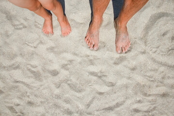 A Feet on the sand of happy people by the sea on nature travel
