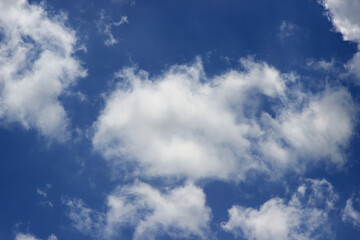 Naklejka na ściany i meble Beautiful blue sky with clouds background.
