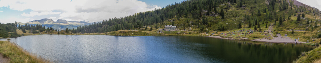 Fototapeta na wymiar Overview Lake Colbricon. August 2022 San Martino di Castrozza, Trentino Alto Adige - Italy
