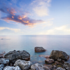 Fototapeta na wymiar quiet sea bay with huge rocks near a coast