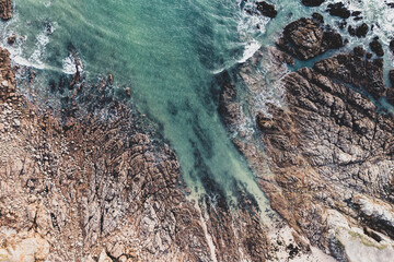 Sea landscape, drone view ocean coast, rocks and ocean in vintage tones.