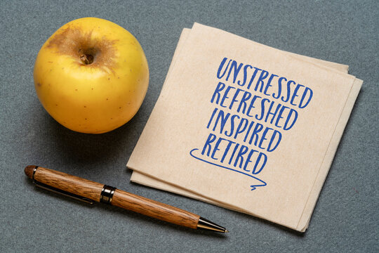 unstressed, refreshed, inspired, retired - retirement cheerful concept on a napkin