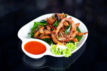 Deep fried sun dried beef with herbs, Thai food.