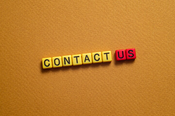 Contact us - word concept on cubes, text