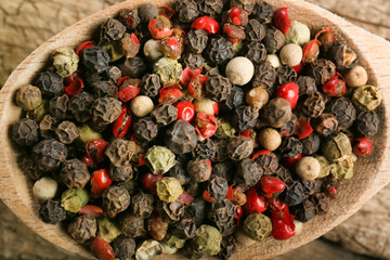 Pepper peas on wooden background close-up