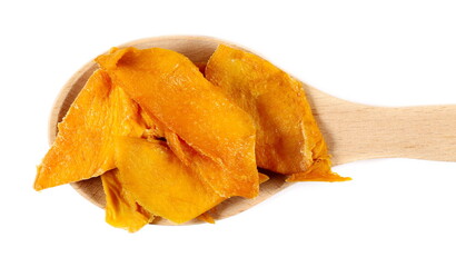 Dried mango slices in wooden spoon isolated on white, top view