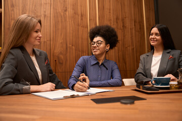 Woman signs the document to start work in company
