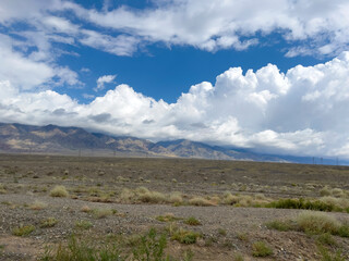 The thick clouds over the mountains.