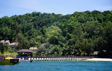 Speedboat docked at the pier to on of the islands in Tunku Abdul Rahman Park                              