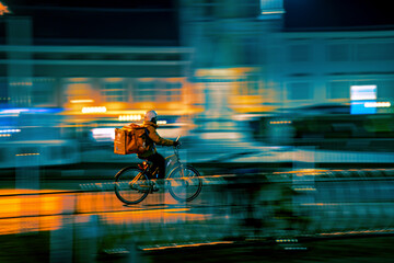 bicycle food delivery in city at night