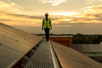 Engineer working setup Solar panel at the roof top. Engineer or worker work on solar panels or solar cells on the roof of business building