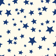 All over seamless repeat pattern with dark navy blue stars with grunge edges tossed on cream. Versatile trendy modern background