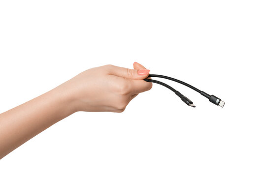 Type C charging wire in a male hand on a white background, isolate.