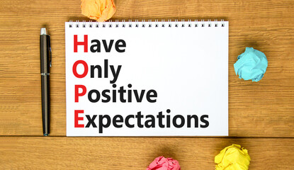 HOPE have only positive expectations symbol. Concept words HOPE have only positive expectations on white note beautiful wooden background. Business HOPE have positive expectations concept. Copy space