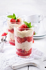 Traditional sweet strawberry dessert with yogurt served as close-up in a glass