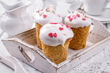 Traditional Neapolitan baba au rum with sugar fondant served as close-up on a white shabby chic...
