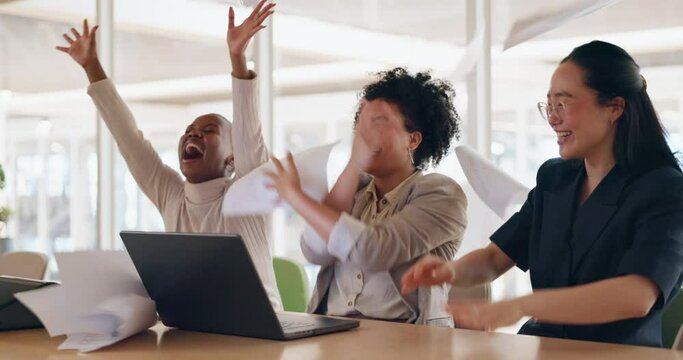 Business, laptop and women throw paper in air, celebration and excited for achievement, new contract and corporate success. Team, female employees and staff with documents, happiness and project goal