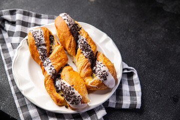 sweet bun puff pastry cream filling, chocolate drops healthy meal food snack on the table copy space food background rustic top view