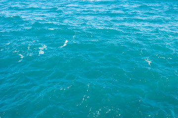 Background of aquamarine sea water surface  