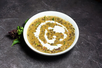 Daal Makhni or butter dal served in dish isolated on grey background top view of indian and...