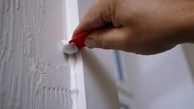 Wall edge grouting down wall corner. Close up.