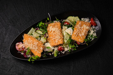 Chicken salad on a black concrete background.
