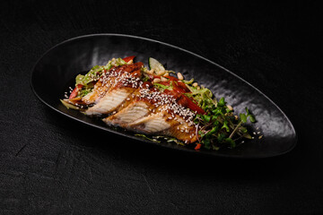 Eel salad on a black background