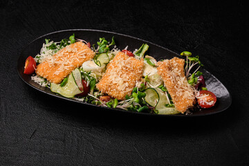 Chicken salad on a black background.