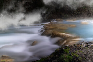 waterfalls produced by the elsa river wrapped in the tuscan fog