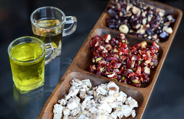 Turkish sweets and hot and cold tea in a Turkish pastry shop as a treat for tourists