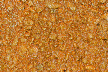 Wrinkled brown stone texture with water on it