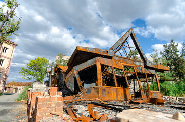 destroyed and burned houses in the city during the war in Ukraine