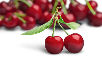 Two Red Cherries Isolated from a Group of Cherries