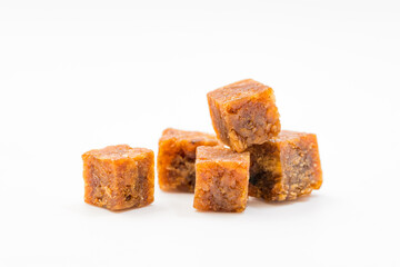 Casual snack beef cubes on a solid color background